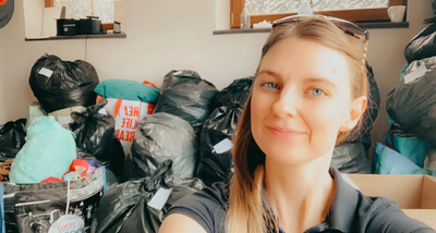 Team member Caroline with some of the collected items for Afghan refugees