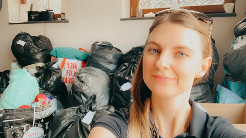 Team member Caroline with some of the collected items for Afghan refugees